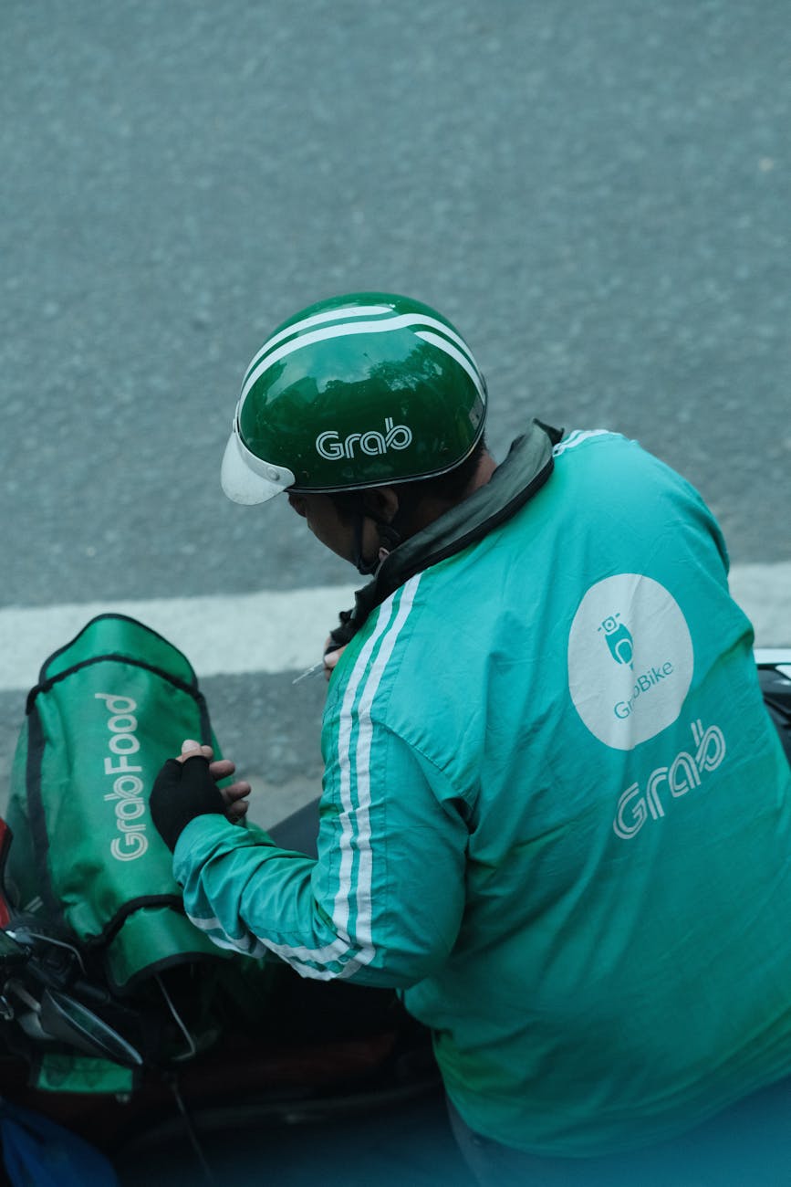 grab food delivery rider with helmet
